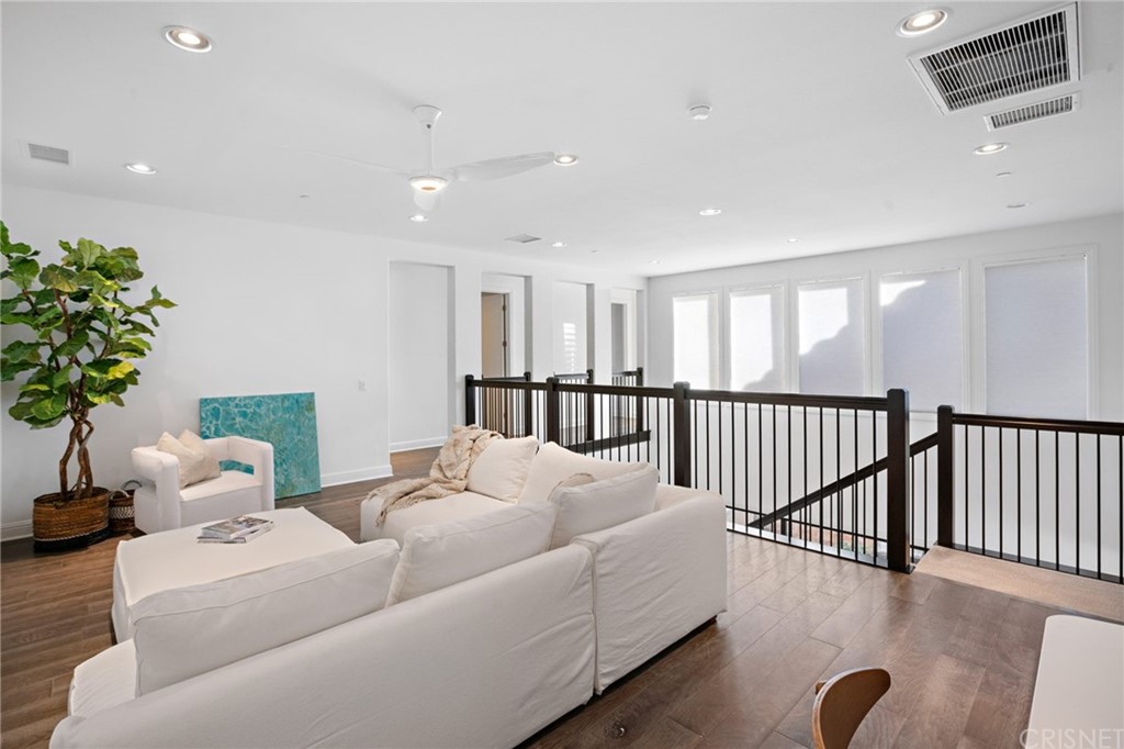 11907 Ancona Way Porter Ranch, CA 91326 - Photo 42 of 67 a living room with furniture potted plant and a window