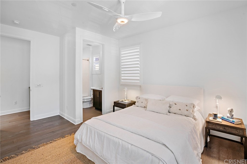 11907 Ancona Way Porter Ranch, CA 91326 - Photo 44 of 67 a bedroom with bed and wooden floor