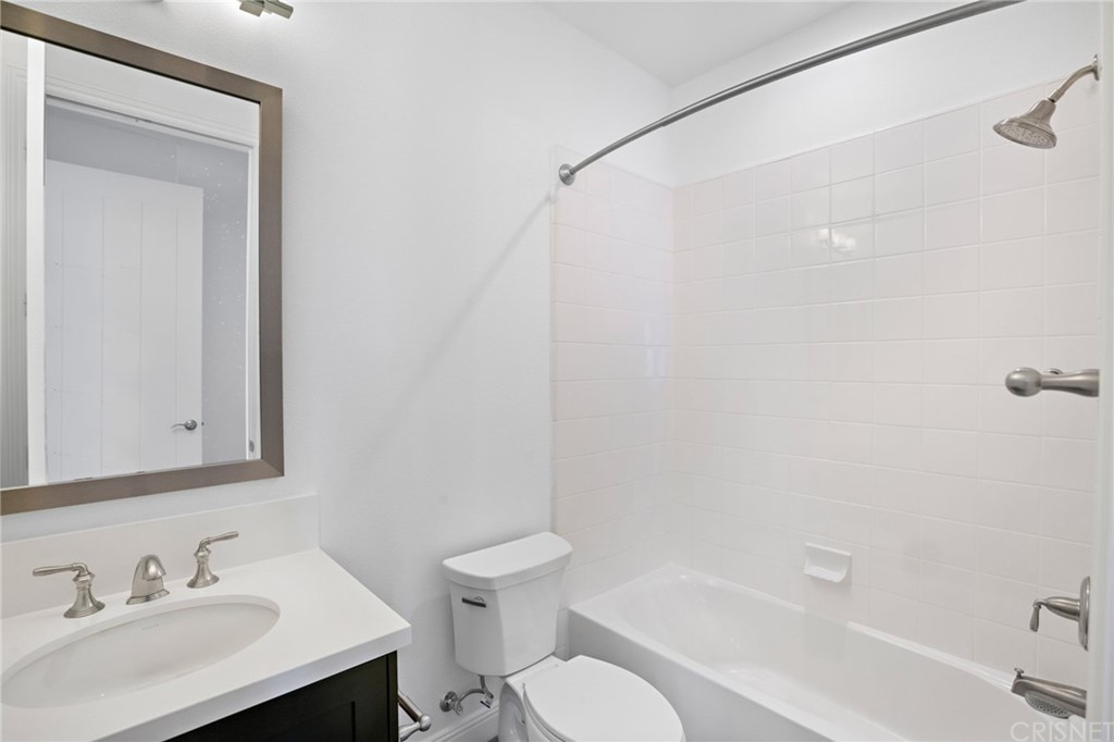 11907 Ancona Way Porter Ranch, CA 91326 - Photo 48 of 67 a bathroom with a sink toilet and shower