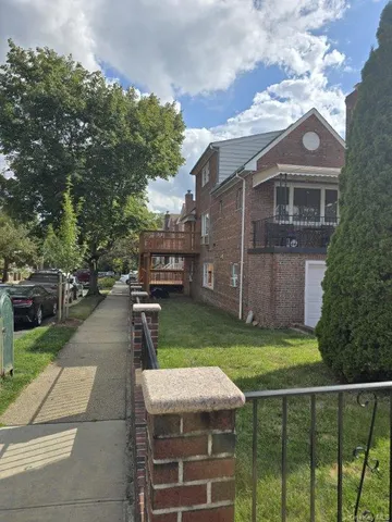 a front view of a house with a yard table and chairs