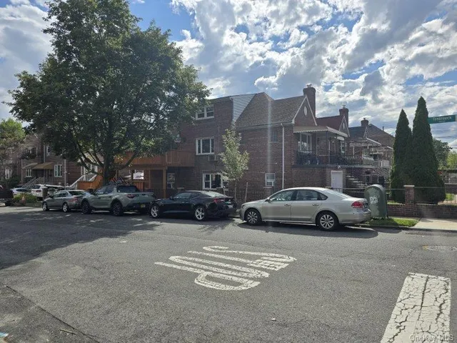 a view of street with parked cars
