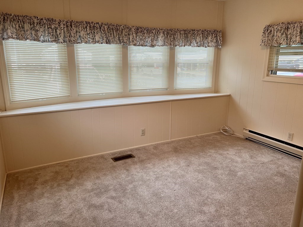 25 St James Circle Hudson, MA 01749 - Photo 12 of 15 a view of an empty room with a window