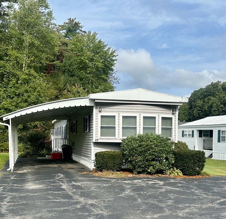 25 St James Circle Hudson, MA 01749 - Photo 2 of 15 front view of a house with a yard
