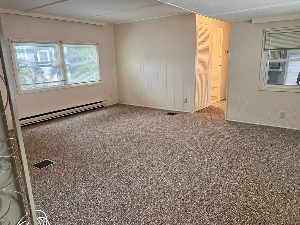 25 St James Circle Hudson, MA 01749 - Photo 8 of 15 an empty room with windows and closet