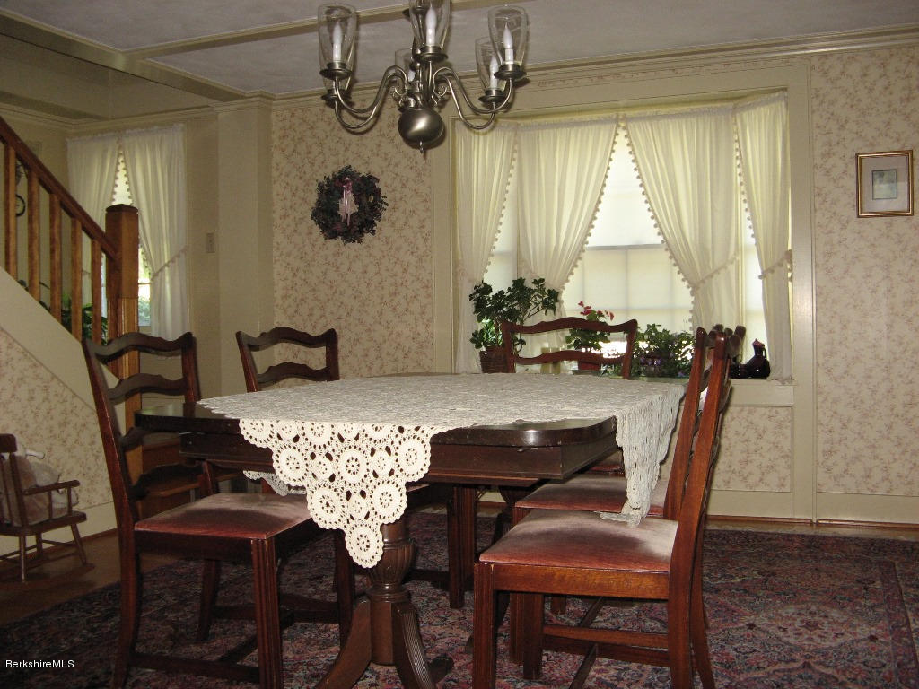 525 E Road Clarksburg, MA 01247 - Photo 11 of 24 a view of a dining room with furniture and chandelier