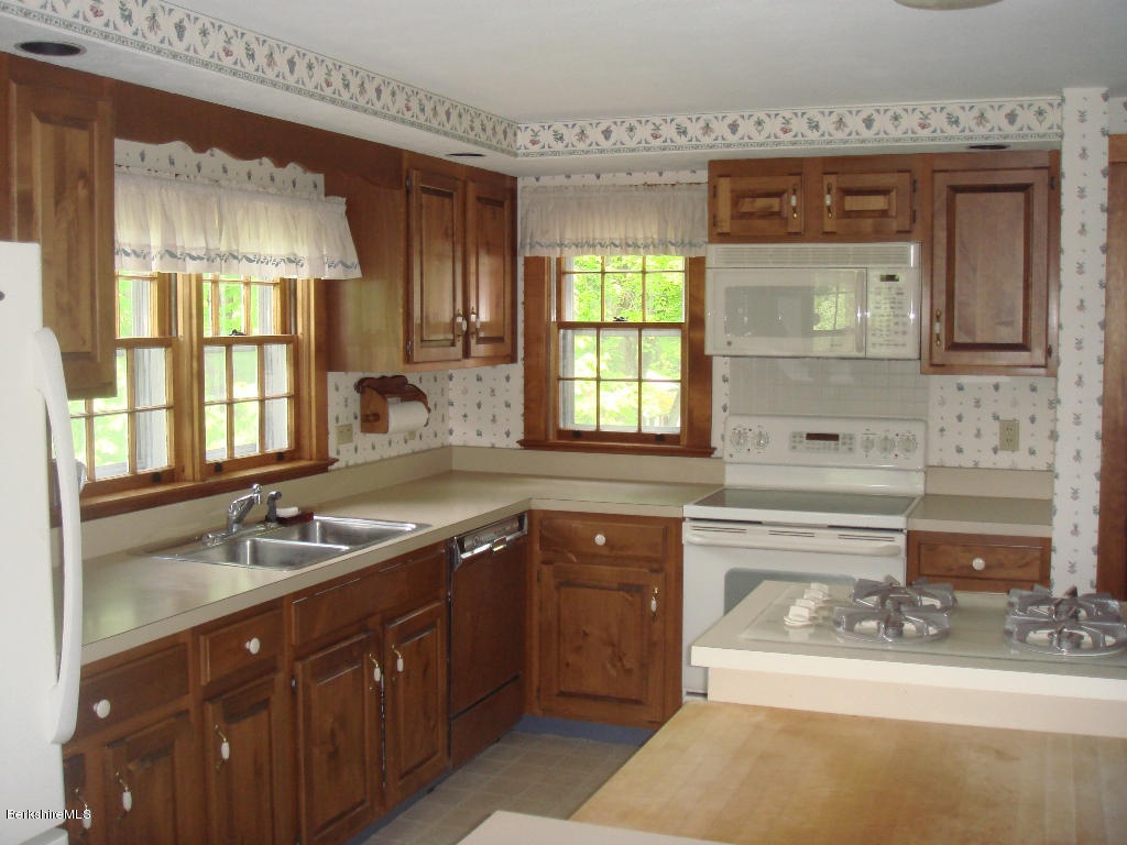 525 E Road Clarksburg, MA 01247 - Photo 13 of 24 a bathroom with a sink vanity and mirror