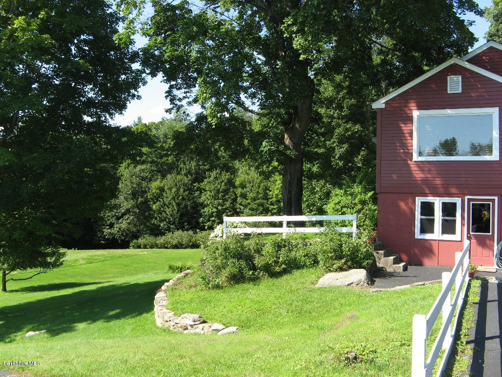 525 E Road Clarksburg, MA 01247 - Photo 18 of 24 a view of a house with a yard porch and sitting area