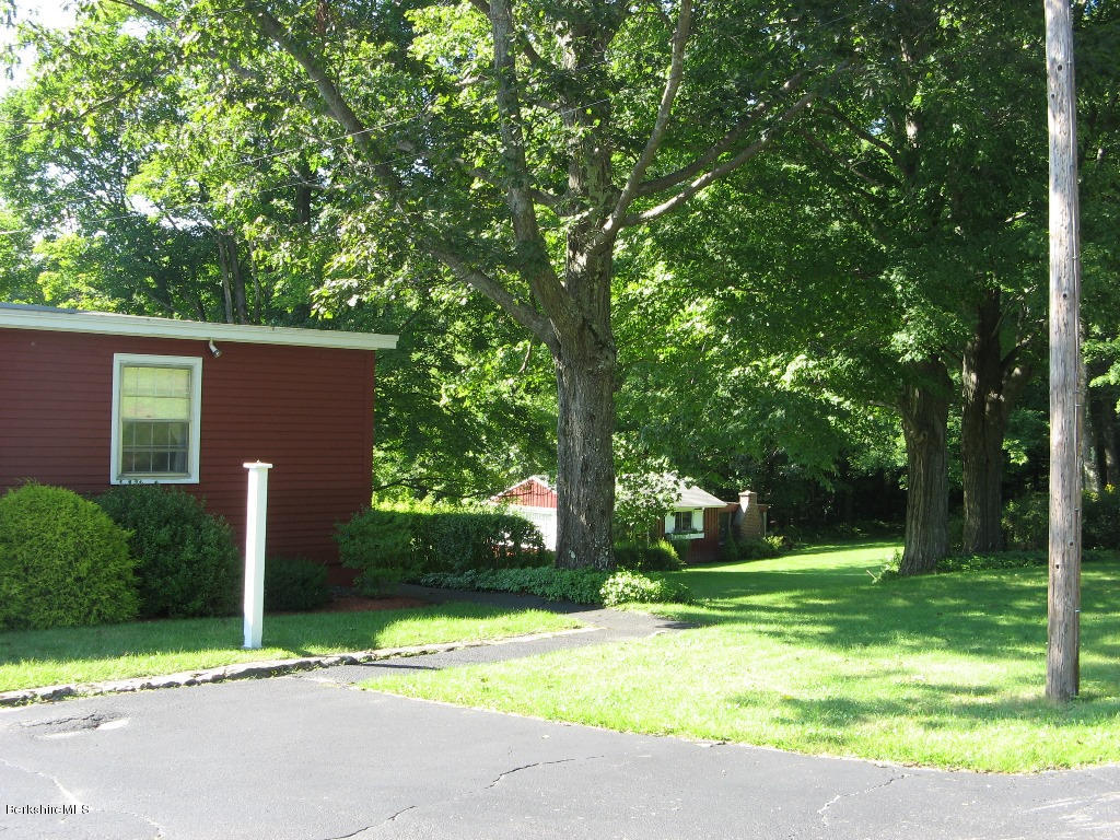 525 E Road Clarksburg, MA 01247 - Photo 23 of 24 a backyard of a house with fountain and large tree