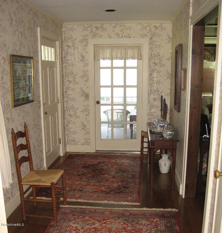 525 E Road Clarksburg, MA 01247 - Photo 7 of 24 a front view of a house with outdoor seating