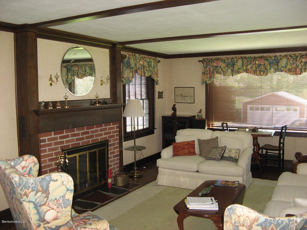 525 E Road Clarksburg, MA 01247 - Photo 10 of 24 a living room with furniture a fireplace and a large window