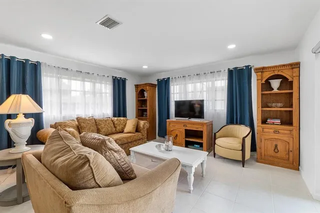 a living room with furniture and a window