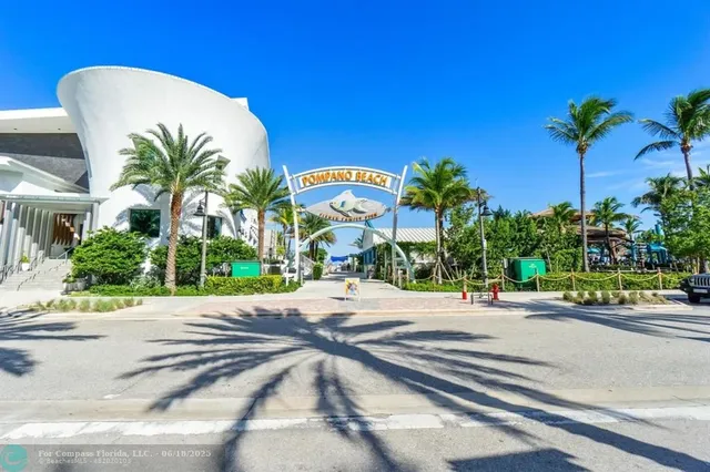 a view of a balcony with chairs potted plants