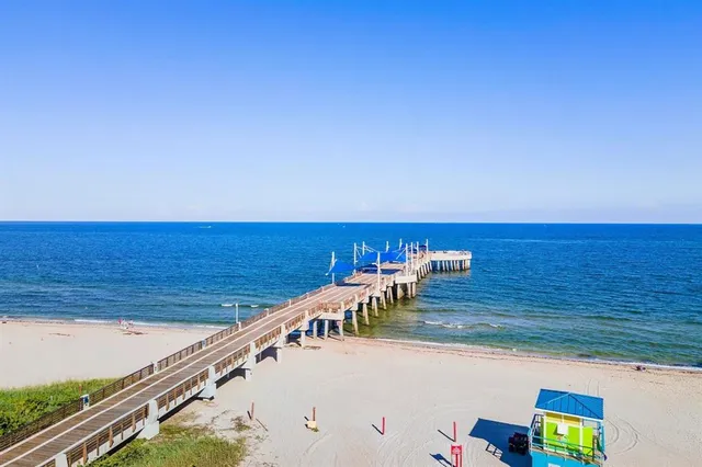 a view of a balcony with an ocean view