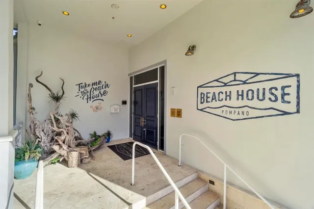 a view of a hall way with furniture