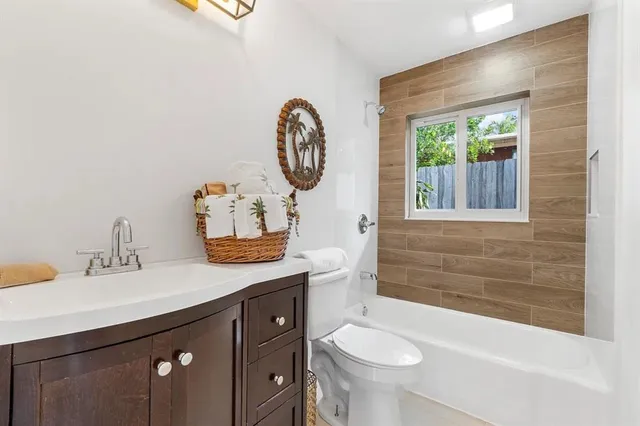 a bathroom with a sink a toilet and a bathtub