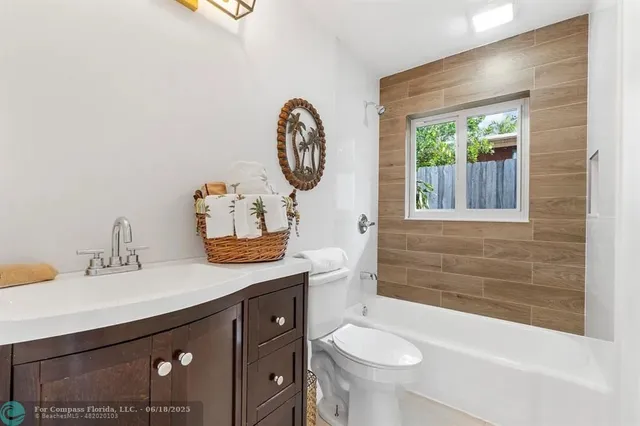 a bathroom with a sink a toilet and a bathtub