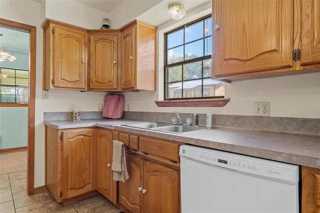 a very nice looking room with many windows and furniture