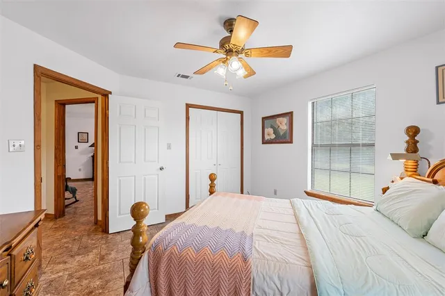 a living room with furniture a chandelier and a window