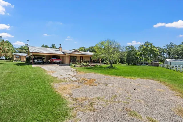 a view of a house with a big yard