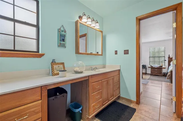 a house view with a sitting space and garden