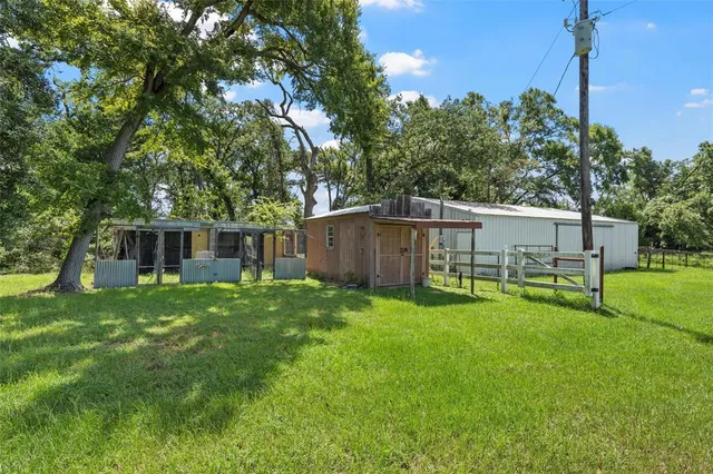 a backyard of a house with lots of green space