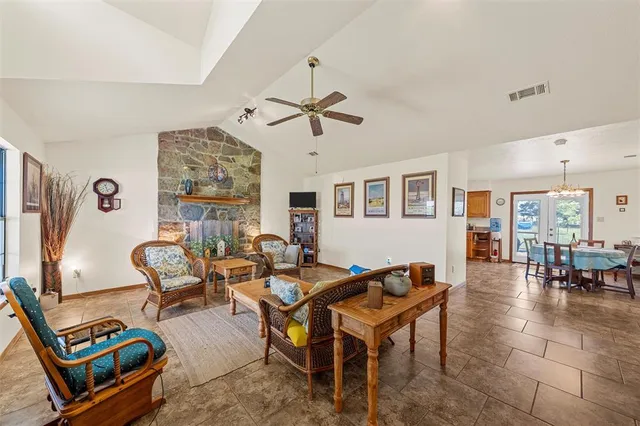 a living room with furniture a couch and a window