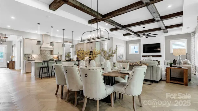a large kitchen with a table and chairs