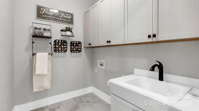 a bathroom with a sink and mirror