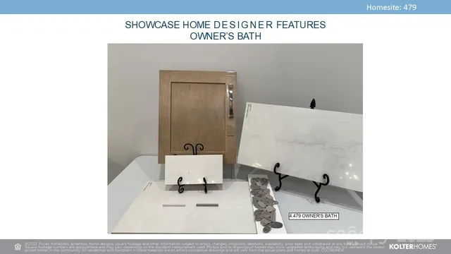 a view of a living room with a chair and a potted plant