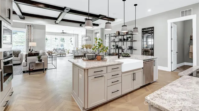 a large white kitchen with lots of counter space