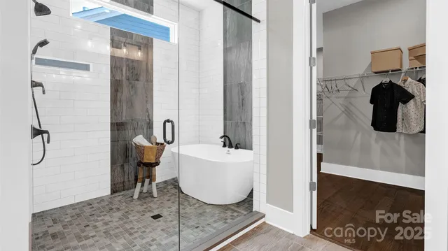 a bathroom with a tub and a shower