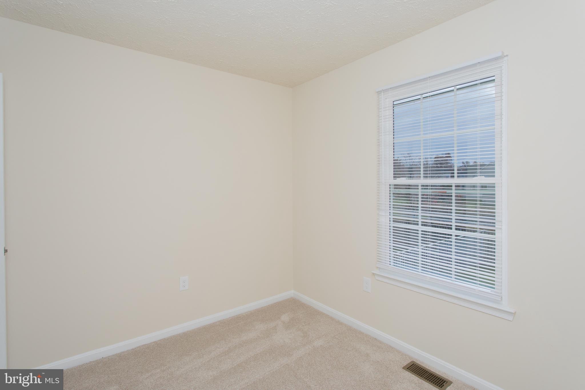 5704 Springfish Place Waldorf, MD 20603 - Photo 34 of 38 a view of an empty room with a window