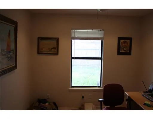 a black and white wall with a window