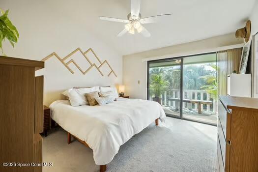 33 Cove Road Melbourne Beach, FL 32951 - Photo 13 of 34 a bedroom with a large bed and a large window with outer view