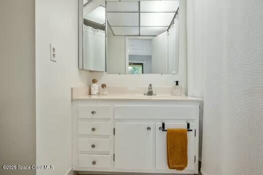 33 Cove Road Melbourne Beach, FL 32951 - Photo 17 of 34 a bathroom with a sink and a mirror
