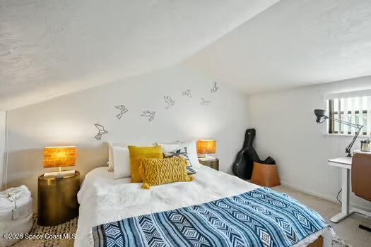 33 Cove Road Melbourne Beach, FL 32951 - Photo 27 of 34 a bedroom with a bed and wooden floor