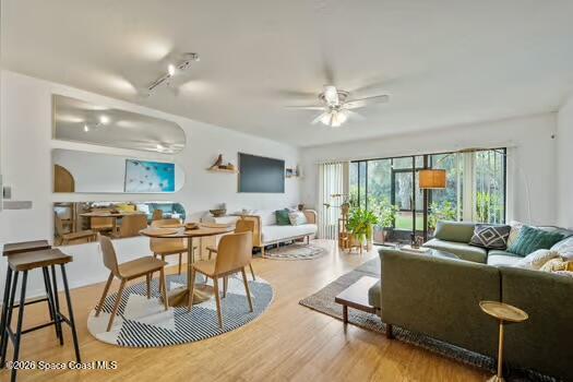 33 Cove Road Melbourne Beach, FL 32951 - Photo 3 of 34 a living room with furniture and a large window