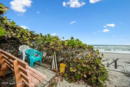 33 Cove Road Melbourne Beach, FL 32951 - Photo 34 of 34 a view of a balcony with an outdoor space and seating