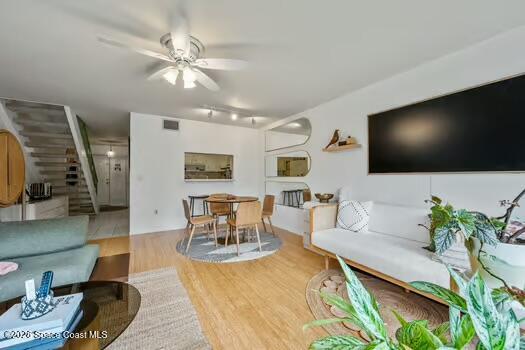 33 Cove Road Melbourne Beach, FL 32951 - Photo 6 of 34 a living room with furniture and a flat screen tv
