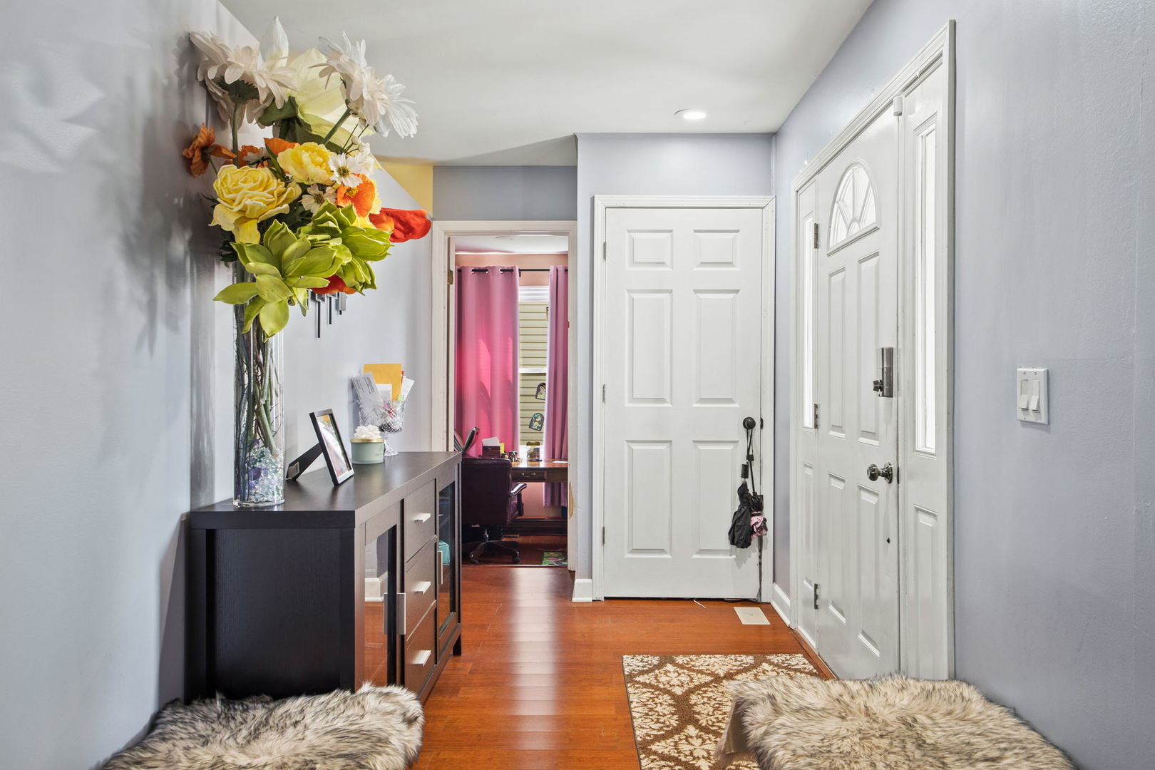 8 Greenvale Road Vernon Hills, IL 60061 - Photo 2 of 21 a bedroom with a bed table and a couch