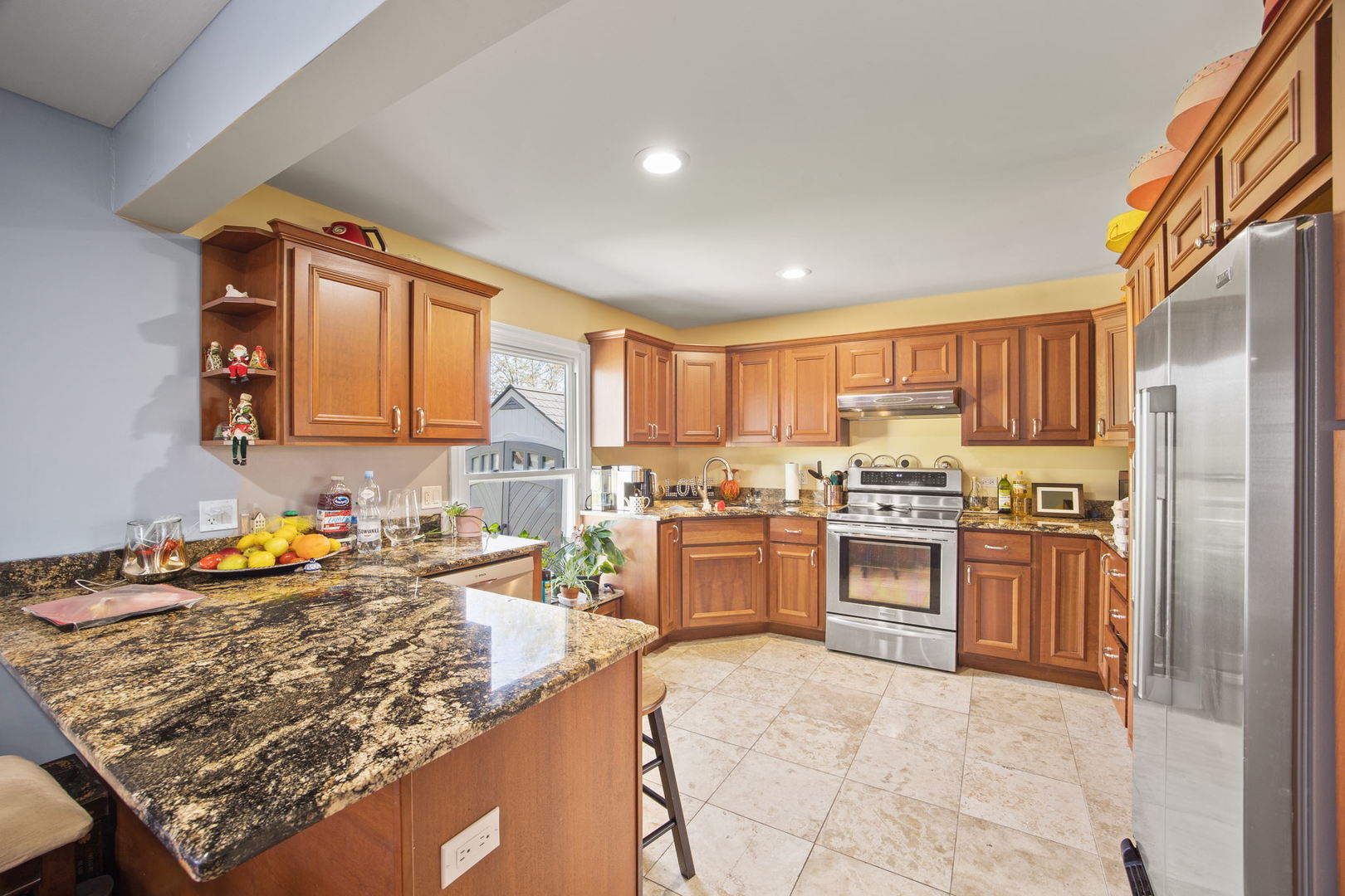 8 Greenvale Road Vernon Hills, IL 60061 - Photo 8 of 21 a kitchen with stainless steel appliances granite countertop a stove top oven a sink dishwasher a refrigerator and cabinets with wooden floor