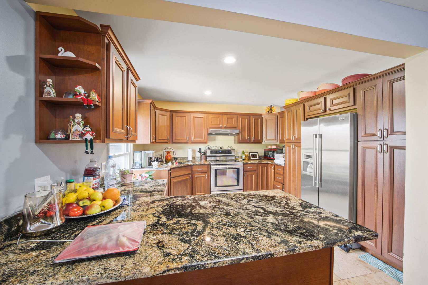 8 Greenvale Road Vernon Hills, IL 60061 - Photo 9 of 21 a kitchen with stainless steel appliances granite countertop a sink stove and refrigerator