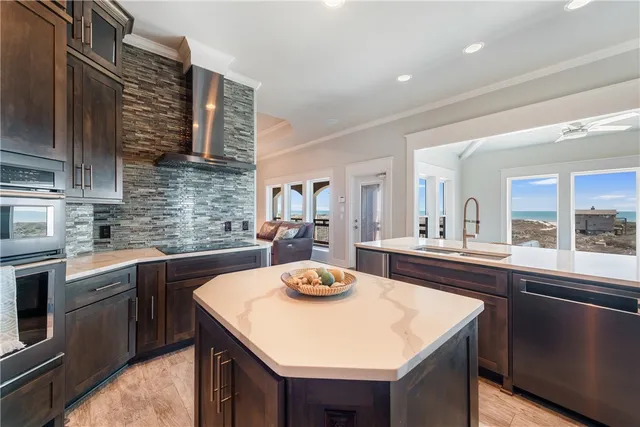 a kitchen with granite countertop a sink and stove