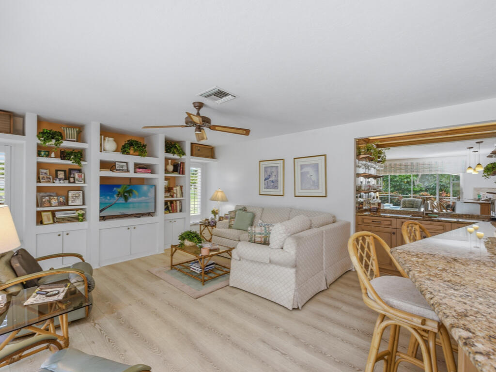 314 Torrey Pines Point Naples, FL 34113 - Photo 19 of 21 a living room with furniture a rug and a large window