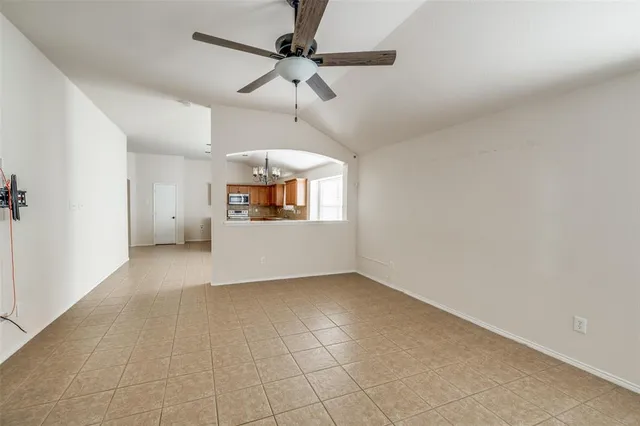 a view of a kitchen with a dishwasher cabinets and a window