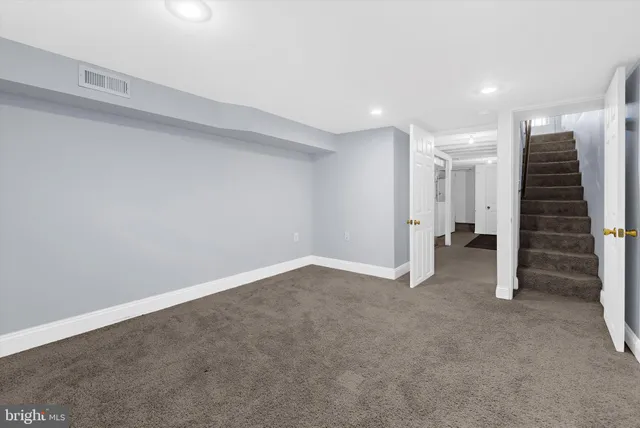 a view of an empty room with a hallway