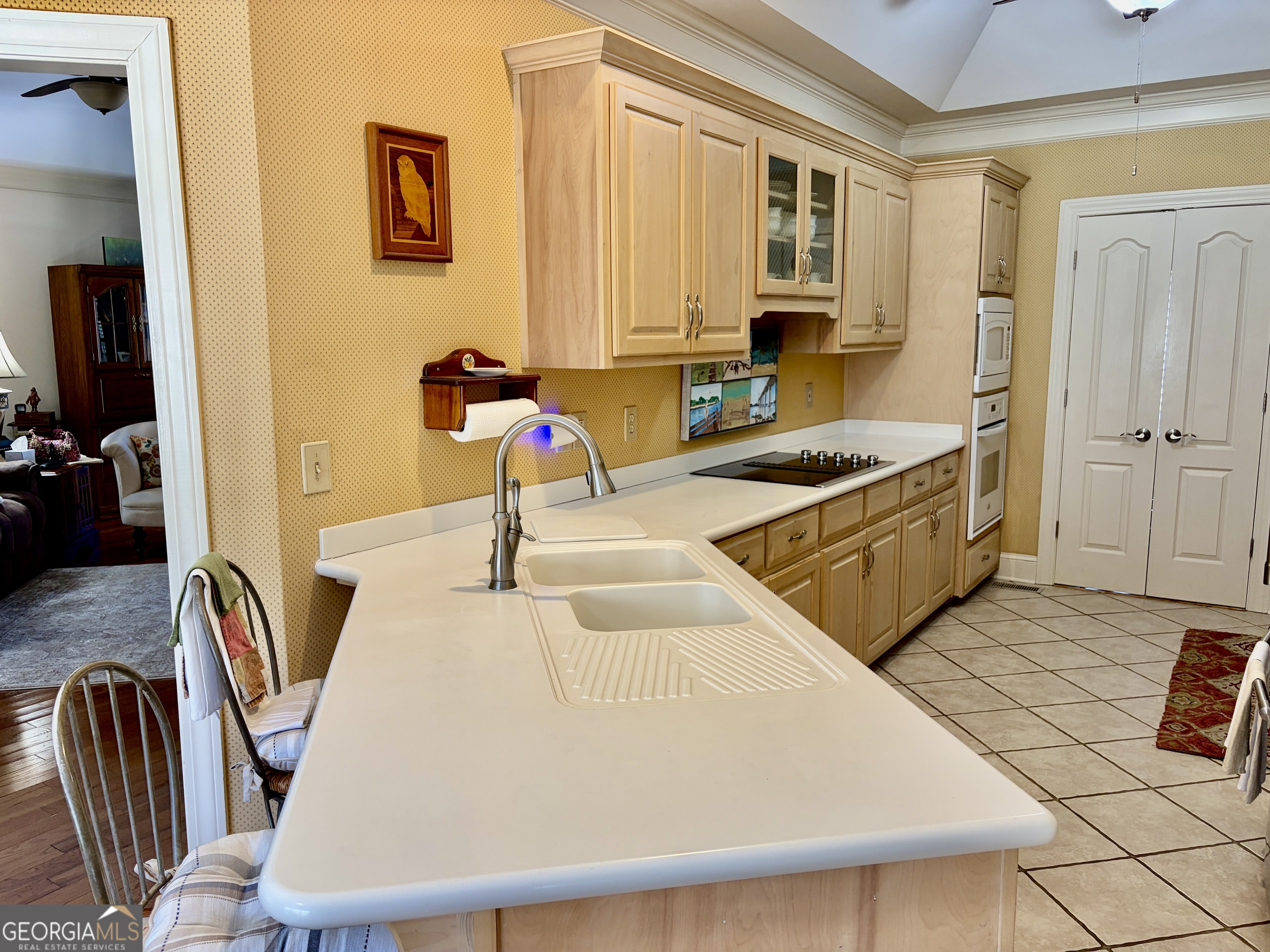 14 Saddlebrook Drive Rome, GA 30161 - Photo 27 of 29 a living room with stainless steel appliances furniture a flat screen tv and a window