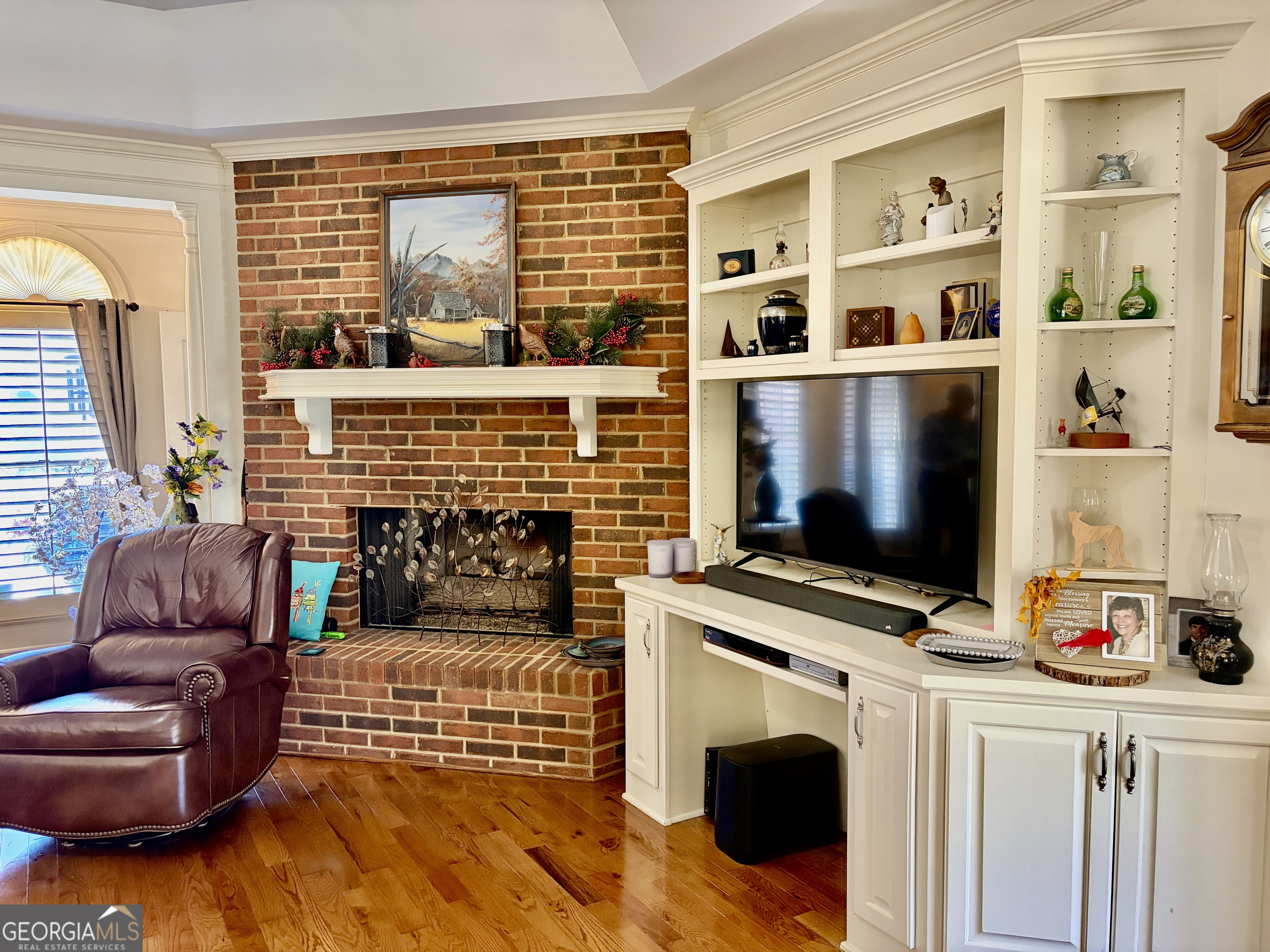 14 Saddlebrook Drive Rome, GA 30161 - Photo 9 of 29 a living room with furniture a flat screen tv and a fireplace