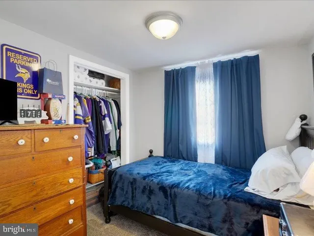 a bed room with a bed and a window