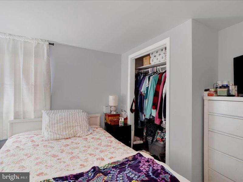 143 Pawnee Avenue Dover, PA 17315 - Photo 15 of 23 a bedroom with a bed and a walk in closet
